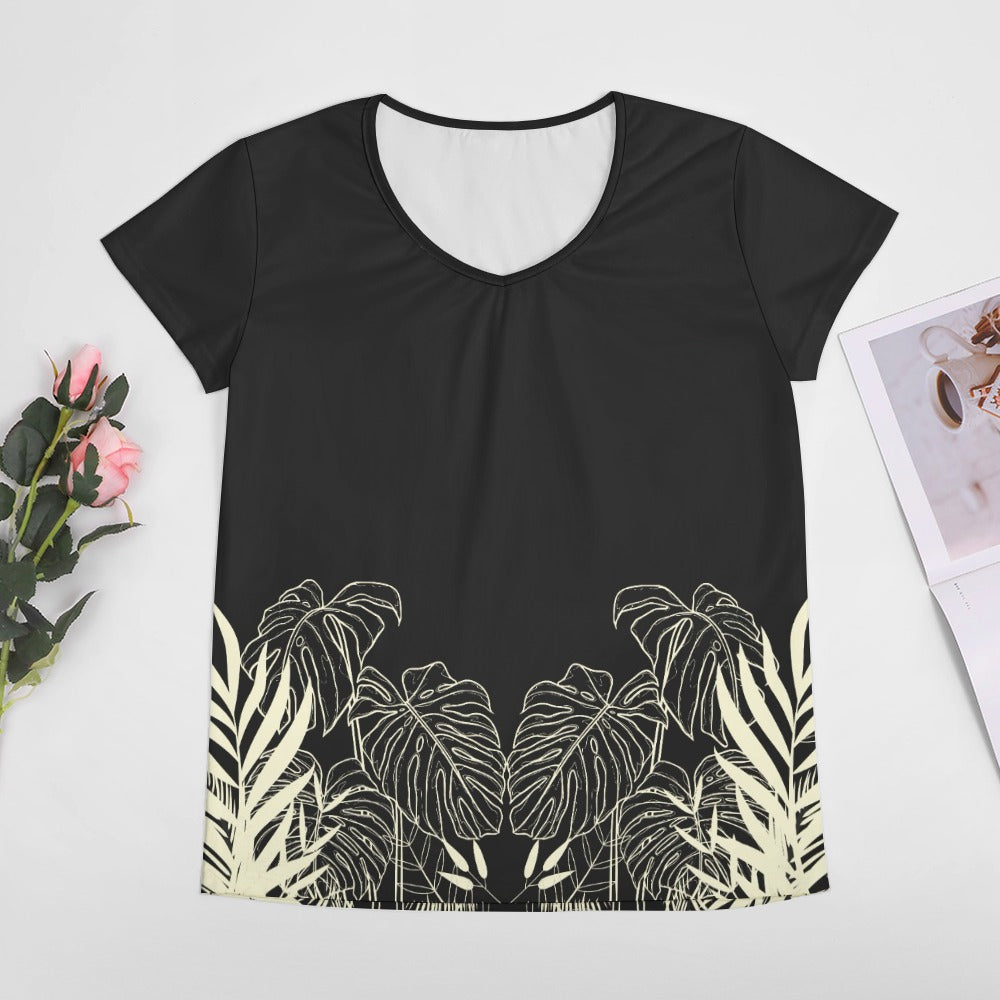 Stay effortlessly stylish and comfortable with our Black Designer Original Graphic Print V-Neck T-shirt! The tropical leaf print wrapping around just above the hemline adds a unique touch. Pair it with the matching slacks for a complete, chic look. Upgrade your wardrobe with this must-have piece!