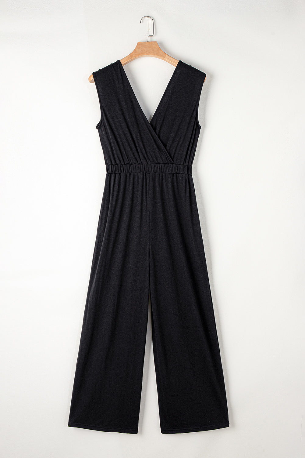 Get ready to turn heads with our Black Deep V Neck Pleated Crisscross Wide Leg Casual Backless Jumpsuit! This chic and versatile piece features a trendy deep v neck and a unique crisscross design, while the pleated details and wide leg cut give it a flattering and stylish look. Perfect for any occasion, from a casual day out to a night out on the town!