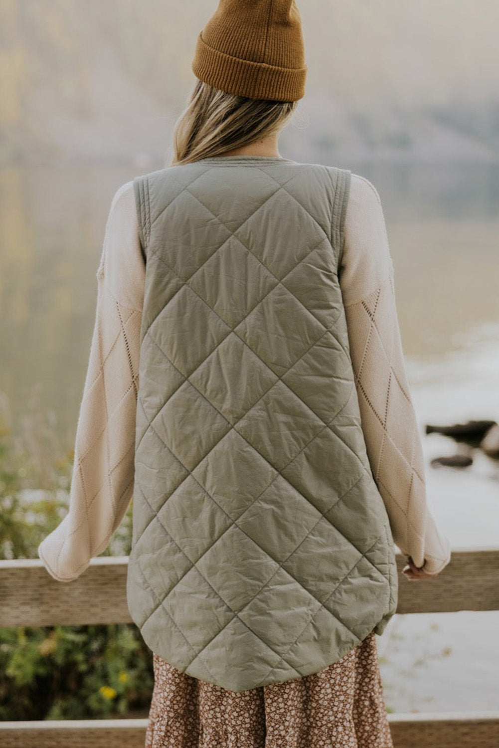 Elevate your style with our Grass Green Quilted Long Vest Jacket with Pockets! Made with premium quilted fabric, this vest offers both fashion and function. Stay warm and stylish with its longer length and convenient pockets. Perfect for any occasion, our vest is a must-have addition to your wardrobe.