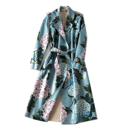 Be effortlessly stylish and protected from the rain with our Floral Trench Coat! Featuring a beautiful hydrangea print, tie closure, and sleeve cuffs, this mid-length raincoat will keep you dry and looking fabulous. Don't let the weather dull your fashion - shine brightly in our Floral Trench Coat!