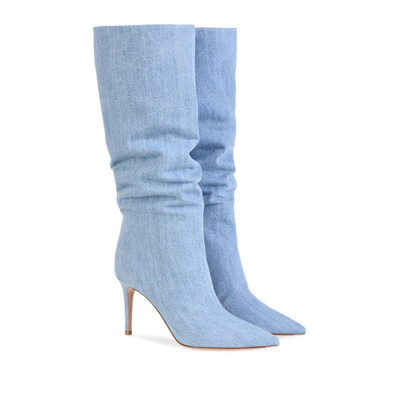 Elevate your style with our High Heel Mid Calf Denim Boots! Made with light blue denim and a pointed toe, these boots are perfect for any occasion. Step out in confidence and make a statement with these stylish and comfortable boots.