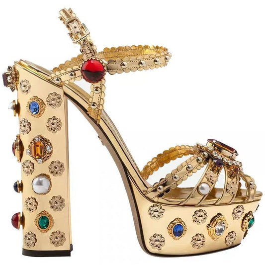 Elevate your style with our Baroque Style Chunky Gold and Jewel Studded Platform Sandals. These sandals are the perfect fusion of modern and classic, with intricate baroque detailing and chunky platform soles. Adorned with luxurious jewel studs, these sandals will add a touch of glamour to any outfit. Step up your fashion game and make a statement with these stunning sandals!