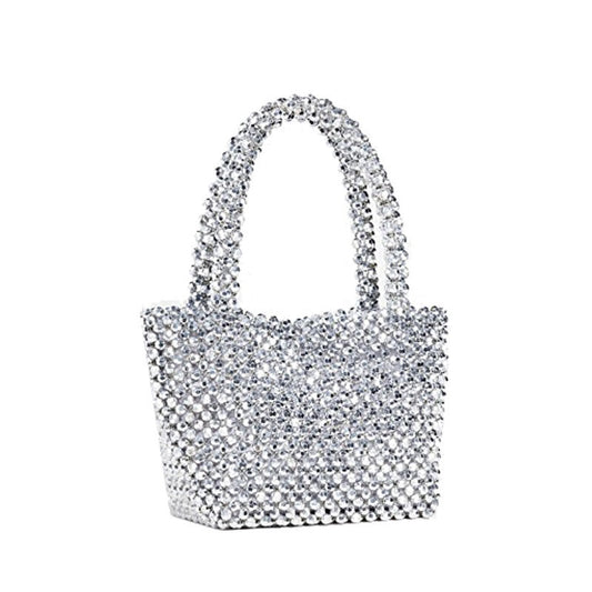 Add a touch of glamour to your outfit with our Silver Rhinestone Bucket Bag! Its top handle allows for easy carrying, while the stand alone design keeps your belongings secure. Perfect for any occasion, this bag will make you stand out in style.