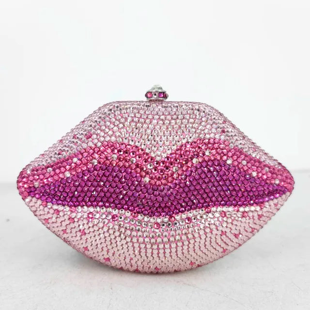 Add a touch of sparkle to any outfit with our Pink Rhinestone Lips Clutch Purse! The bold lips design, adorned with dazzling rhinestones, is sure to make a statement. With the added convenience of a matching shoulder strap, this purse is perfect for any occasion. Stand out with style and confidence!