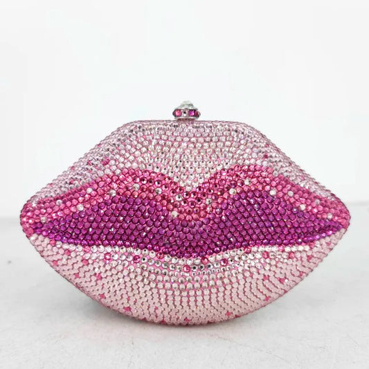 Add a touch of sparkle to any outfit with our Pink Rhinestone Lips Clutch Purse! The bold lips design, adorned with dazzling rhinestones, is sure to make a statement. With the added convenience of a matching shoulder strap, this purse is perfect for any occasion. Stand out with style and confidence!