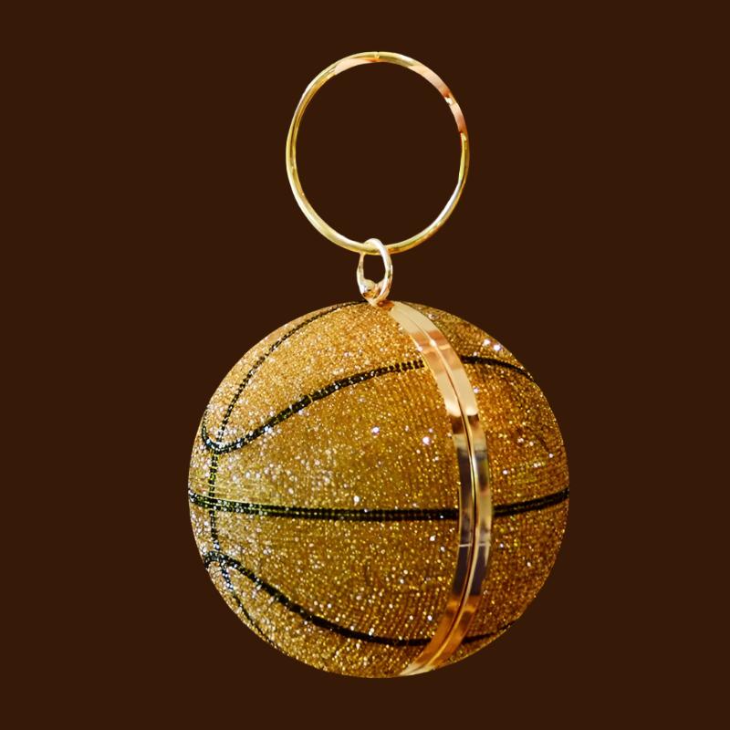 This Rhinestone Studded Basketball Clutch Purse is a stylish and unique accessory that will upgrade any outfit. With its stunning rhinestone studded design, it adds a touch of sparkle and glamour. Perfect for basketball lovers or anyone looking to add a playful twist to their look.