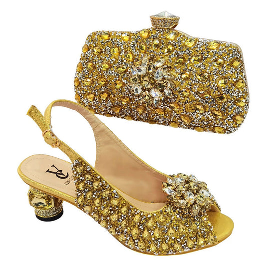 Elevate your ensemble with our Sparkling Rhinestone Shoes &amp; Clutch Set. Each piece is adorned with shimmering rhinestones, adding a touch of luxury to your look. The perfect set for a glamorous night out, these accessories will make you feel like a true fashion icon.