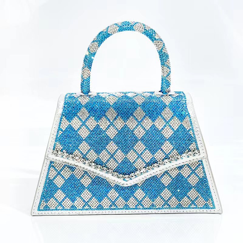 Add sparkle to your style with our Rhinestone Square Stand Alone Top Handle Bag! The rhinestone accents on the bag, purse, and shoulder strap elevate any outfit and make a statement. Stand out from the crowd with this luxurious and eye-catching accessory.