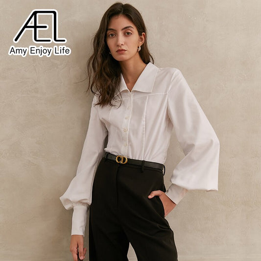 Introducing the perfect blouse for any occasion! Our Women's White Long Sleeve Blouse features a fold down collar and wide cuffs for a unique and stylish look. The button down design allows for versatile wear, making this blouse a must-have in any wardrobe. Stay effortlessly chic with this must-have piece.