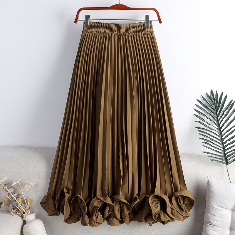 Experience timeless elegance with our Elegant Vintage Irregular Ruffles Pleated Midi Skirt! The high waist and pleats create a flattering silhouette while the irregular ruffles add a touch of vintage charm. The elastic waistband ensures a comfortable fit, making this the perfect addition to your wardrobe. Elevate your style and feel confident in this stunning skirt!