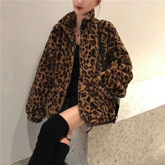 Unleash your wild side with our Faux Fur Leopard Print Jacket! Featuring a trendy collar, zipper closure, and functional pockets, this cozy coat will keep you warm and stylish. Turn heads and make a statement with this must-have piece.