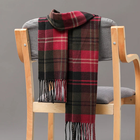 Add a playful pop to your winter look with this thick soft plaid scarf. Unisex and stylish, it features trendy tassels and a cozy warmth that will elevate any outfit. Stay snug and stylish all season long with this quirky accessory.