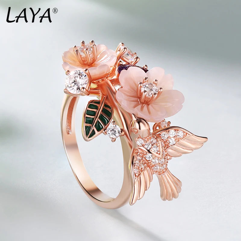 Flaunt your fun, whimsical side with this Zircon and Natural Shell Bird and Flowers Women's Ring. Available in Sterling Silver or Rose Gold, the ring features a unique bird and flower design crafted with sparkling zircon and natural shell. A playful addition to any outfit!