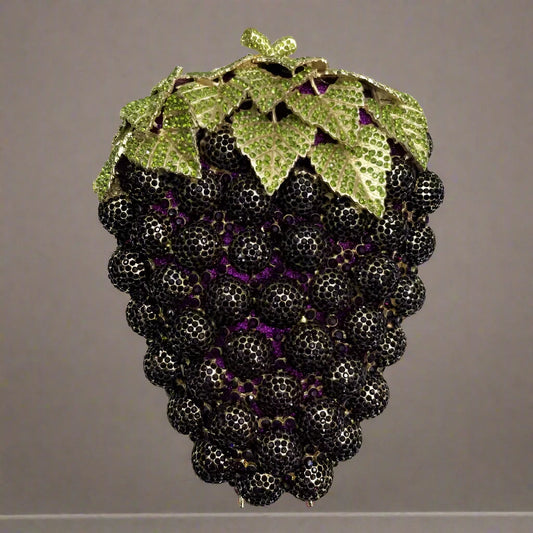 Stand out in the crowd with our Dazzling Rhinestone Grape Shaped Clutch Purse! This bold and striking accessory features a unique grape shape adorned with shimmering rhinestones. Perfect for adding a touch of glamour and adventure to any outfit. Take a risk and elevate your style with this daring clutch purse!