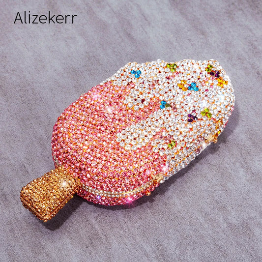 Indulge in fun and fashion with our Ladies Ice Cream Shaped Rhinestone Clutch Bag! This quirky clutch features a playful ice cream bar design adorned with sparkling rhinestones. Plus, it comes with a chain shoulder strap for easy carrying in 6 delicious flavors. Perfect for adding a touch of whimsy to any outfit!