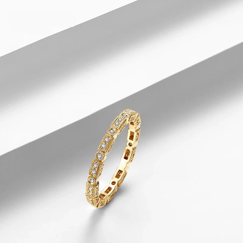 This stunning 18K gold ring features a natural diamond, making it a luxurious and timeless piece of fine jewelry from Thread Harbor Clothing Company. Add a touch of elegance and sophistication to any outfit with this beautiful and high-quality accessory. Perfect for special occasions or everyday wear.