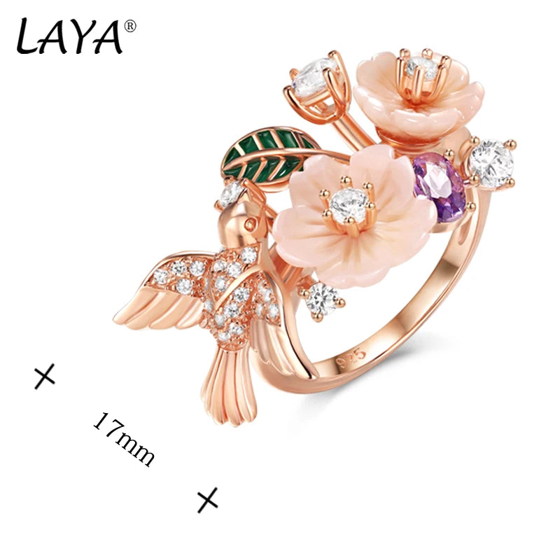 Flaunt your fun, whimsical side with this Zircon and Natural Shell Bird and Flowers Women's Ring. Available in Sterling Silver or Rose Gold, the ring features a unique bird and flower design crafted with sparkling zircon and natural shell. A playful addition to any outfit!