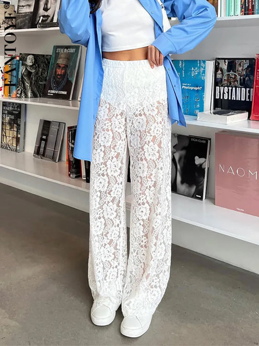 Elevate your fashion game with our High Waist Lace Wide Leg Pants! Featuring a flattering high waist and delicate lace detailing, these pants effortlessly combine comfort and style. The striking black and white color palette adds a touch of elegance to any outfit. Make a statement and turn heads wherever you go!