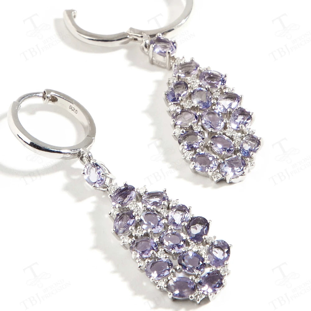 Elevate your look with our exquisite lavender-colored drop earrings, adorned with natural Iolite gemstones. Crafted with precision and attention to detail, these elegant earrings exude a sense of sophistication and luxury.