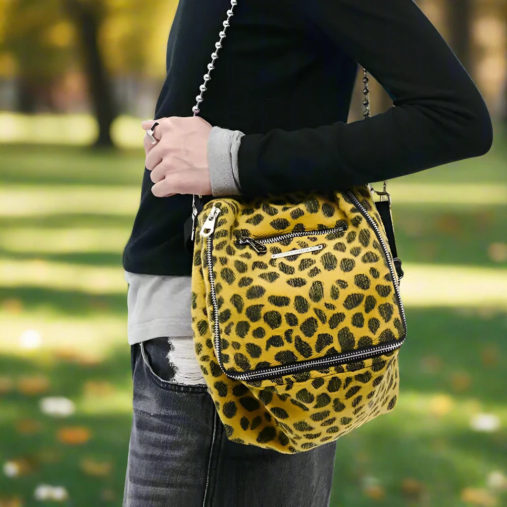 Make a statement with our Fashionable Leopard Print Satchel! This stylish accessory is perfect for those who want to showcase their wild side. The eye-catching leopard print adds a touch of sophistication to any outfit, and the spacious design allows for ample storage. Be bold, be trendy, with our satchel!