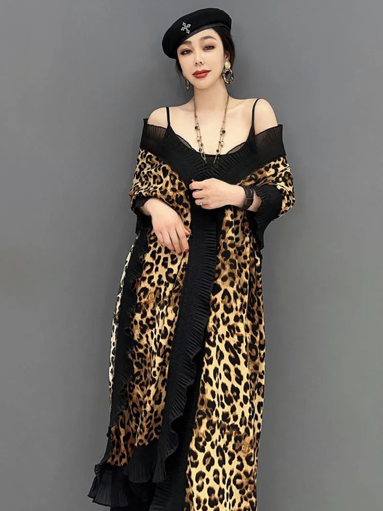 Unleash your fierce and elegant side with our Women's Elegant Leopard Print Shawl! This large wrap around shawl boasts a striking leopard print and is finished with a delicate black chiffon trim. Experience comfort and style in one luxurious accessory. Transform any outfit with this statement piece!