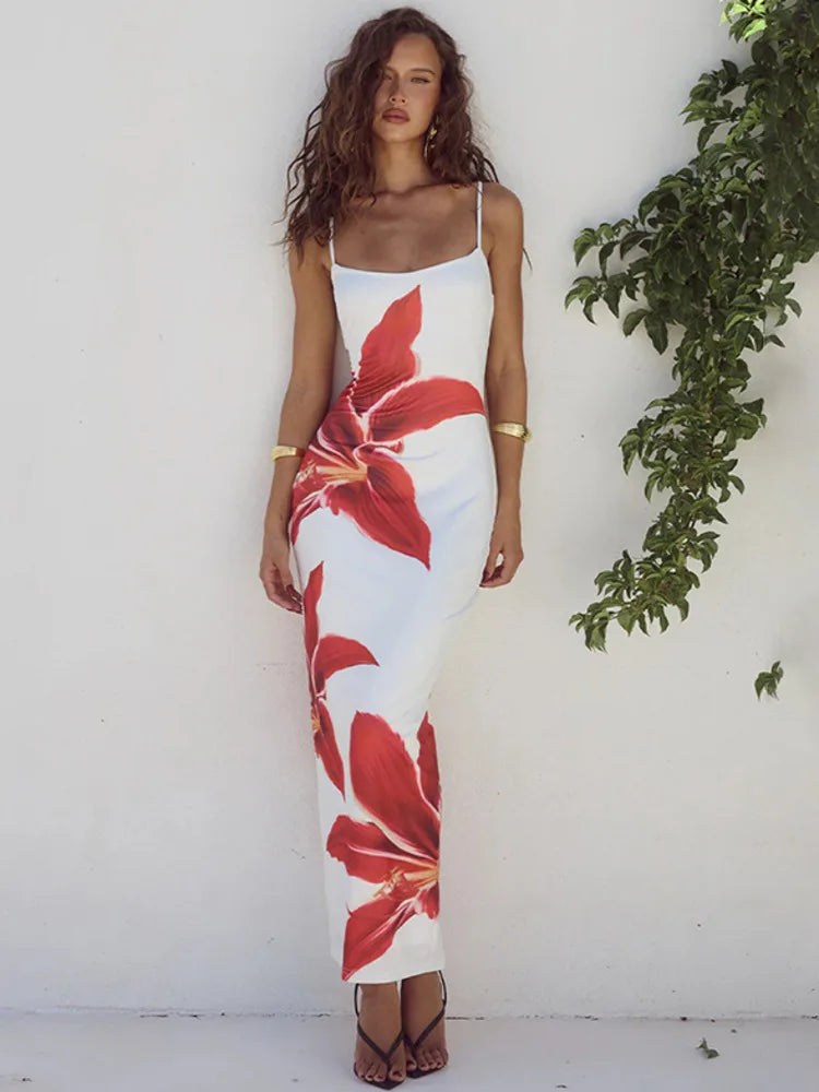 This Summer Spaghetti Strap Floral Print Backless Bodycon Maxi Dress is a must-have for any fashion-forward woman! With its vibrant floral print and flattering bodycon silhouette, this dress is perfect for any summer occasion. The backless design adds a touch of allure, making you feel confident and beautiful. Don't miss out on this stunning dress! This dress is white with large orange day lilies 