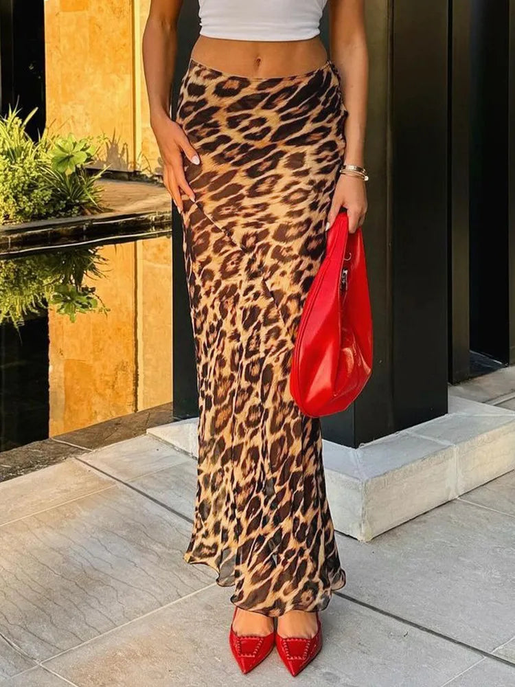 Embrace your wild side with our Leopard Print Chiffon High Waisted Summer Maxi Skirt. Made from light and see through chiffon, this skirt is perfect for a day at the beach. Channel your inner beach goddess and turn heads in this stunning summer essential!