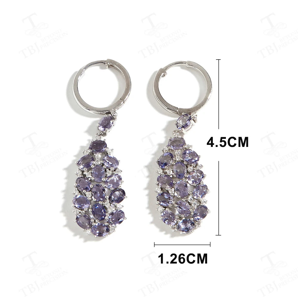 Elevate your look with our exquisite lavender-colored drop earrings, adorned with natural Iolite gemstones. Crafted with precision and attention to detail, these elegant earrings exude a sense of sophistication and luxury.