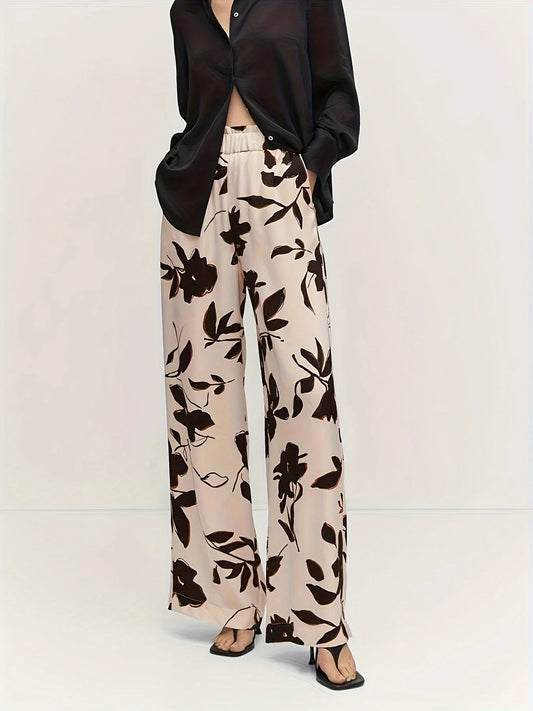 These Plus Size Floral Wide Leg Elastic Waist Casual Pants feature a beautiful black floral design on a natural white background. The elastic waist provides comfort and flexibility, while the wide leg design adds a touch of style. Perfect for casual wear, these pants are a must-have for any wardrobe.