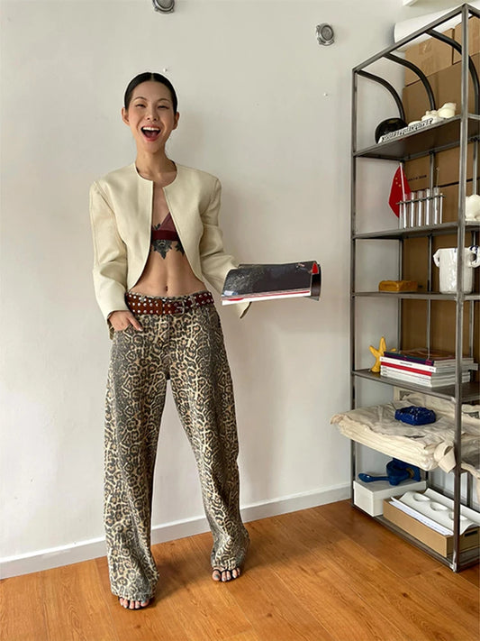 Featuring a bold leopard print pattern, these jeans effortlessly combine trendiness with timeless appeal. The wide leg silhouette adds a touch of retro flair, while the high-quality denim ensures durability and comfort for all-day wear.