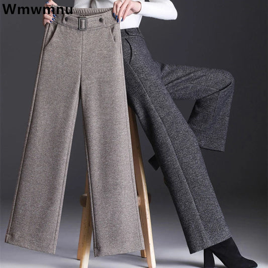 Experience the ultimate comfort and style with our elegant Wool Blend Wide Leg Pants! Made with a luxurious wool and cotton blend, these pants feature a high waist for a flattering fit, a buckle in the front for added detail, and an elastic waistline in the back for all-day comfort. Perfect for fall and winter, upgrade your wardrobe today!