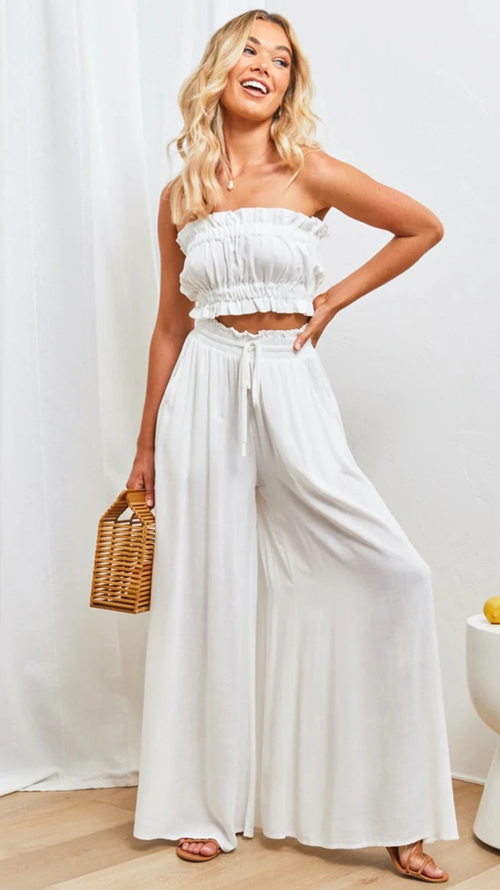 In White.  Elegant.  Gathered elastic waist with drawstring 