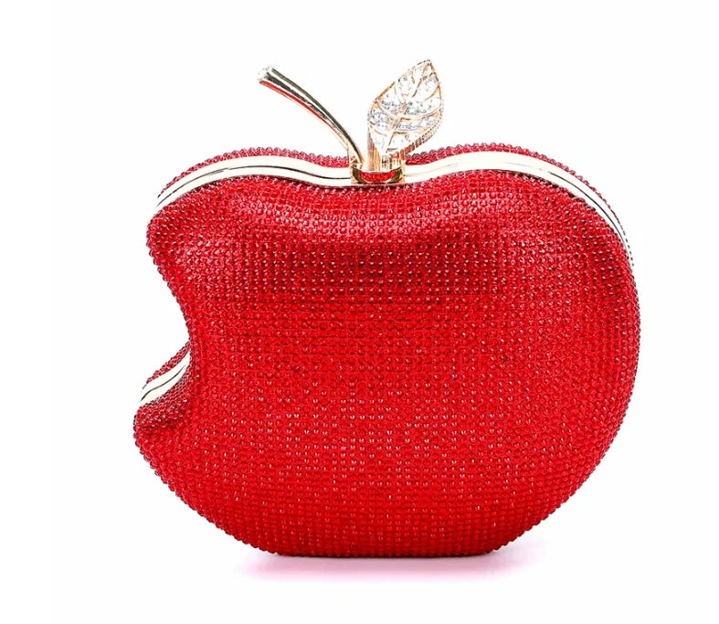    Get ready to shine with our Rhinestone Apple Novelty Clutch with Chain! The stunning rhinestone design adds a touch of glamour and the detachable chain allows for versatility in wearing. Perfect for a fun night out or a special occasion, this clutch is guaranteed to make a statement and turn heads!