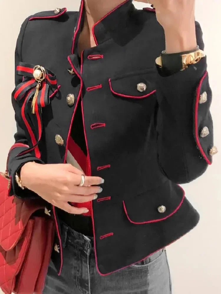 Experience unbeatable style and functionality with our British Military Crop Style Jacket! Designed with black fabric and red trim, this jacket exudes classic elegance. The stand-up collar, pockets, and gold buttons add a touch of sophistication, perfect for any occasion. Elevate your wardrobe today!