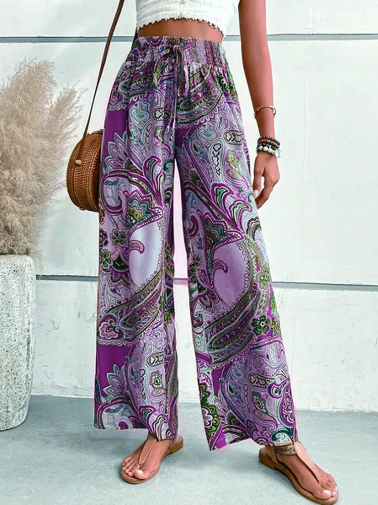 Make a statement with these retro, digital print high waist pants. Not only do they have an elastic waist for maximum comfort, but the wide leg style will give you a boho-chic look. Perfect for any casual occasion, these pants are a fun addition to any wardrobe. Go ahead, flaunt your unique style!