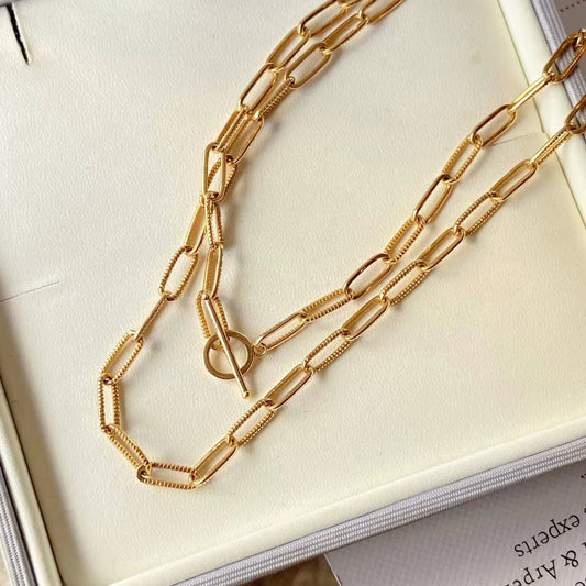 Upgrade your jewelry collection with our 18K Yellow Gold Paperclip Chain Necklace. This stunning piece comes in both 16" and 18" lengths, perfect for layering or wearing solo. Crafted from premium quality 18K gold, this necklace exudes sophistication and luxury. Elevate any outfit with this fine jewelry essential!