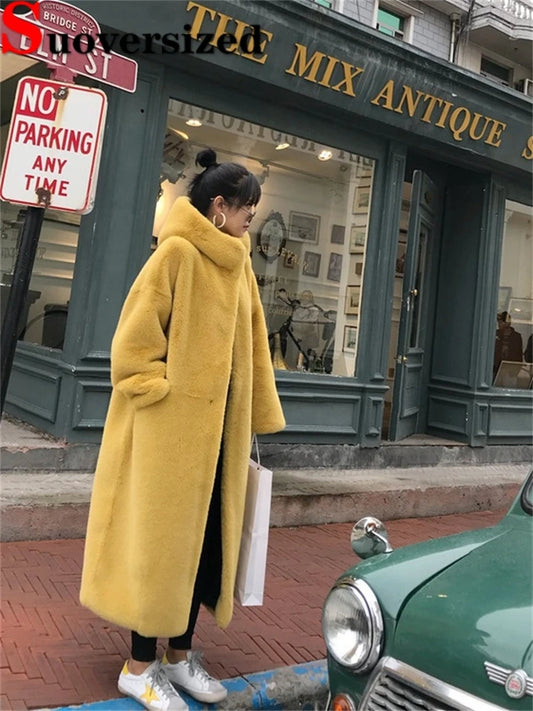 Indulge in luxurious warmth and style with our Plush Luxury Faux Mink Fur Overcoat with Hood. Made from high-quality faux mink fur, this overcoat will keep you cozy and fashionable during the colder seasons. With a stylish hood and soft texture, you'll feel like royalty every time you wear it.