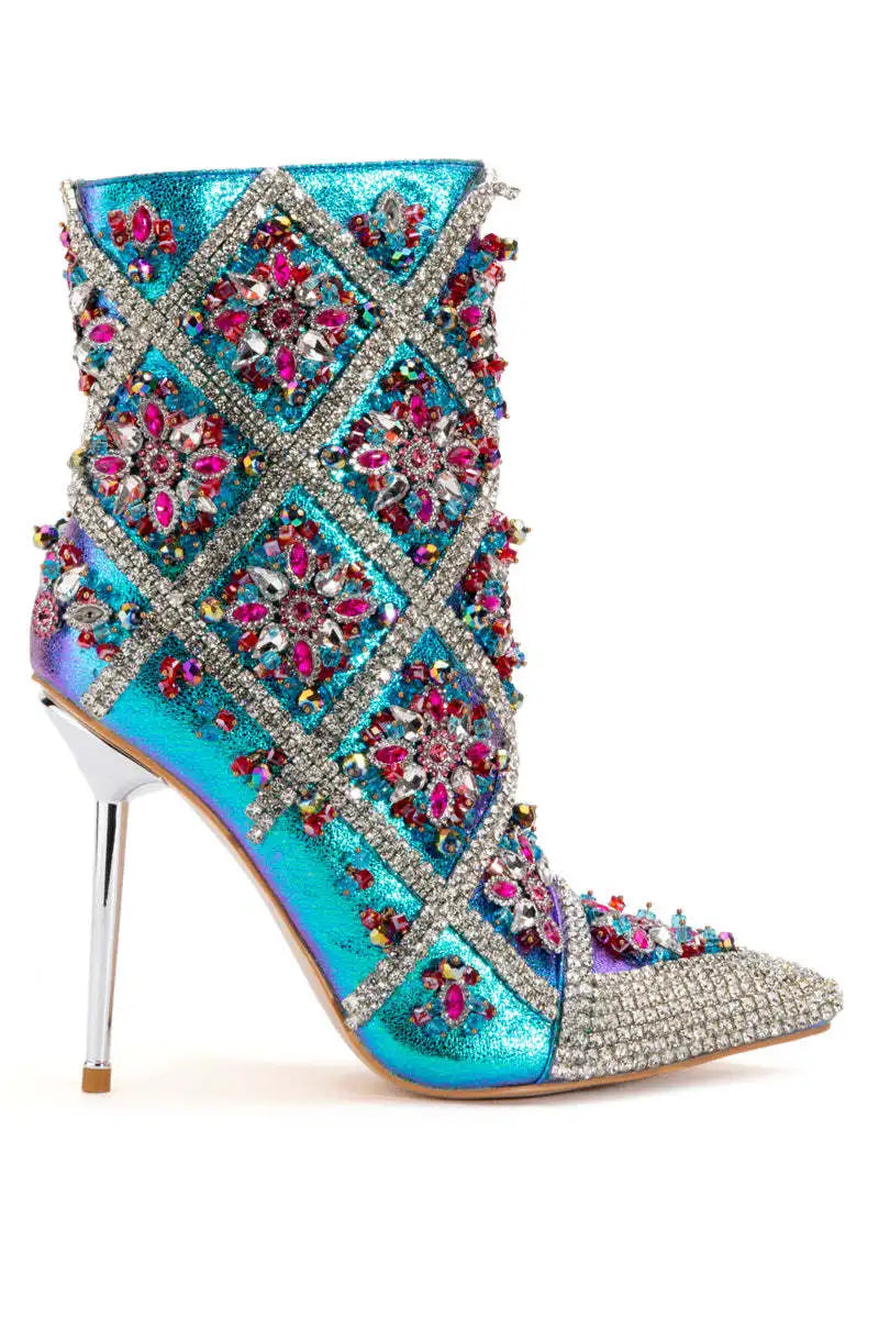 Walk with style in these luxurious Designer Women's Multi Colored Rhinestone Boots. The intricate rhinestone design adds a touch of elegance to any outfit, while the high-quality materials ensure durability and comfort. Elevate your wardrobe with these exclusive boots that are sure to turn heads.