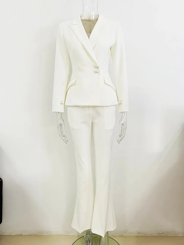 Upgrade your professional wardrobe with our Designer Pant Suit Set! This slim fit blazer and flared pants set features elegant pearl buttons for a touch of sophistication. Stand out in the office and make a statement with this two piece set. Perfect for any powerful and stylish woman!