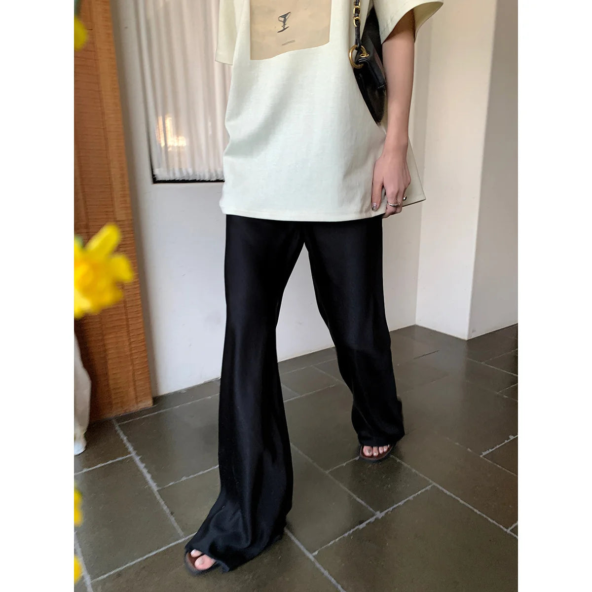 Introducing our Casual Long Wide Leg Elastic Waist Satin Trousers! Perfect for any casual occasion, these trousers offer comfort and style with its elastic waistband and wide leg design. Elevate your wardrobe with this must-have piece!