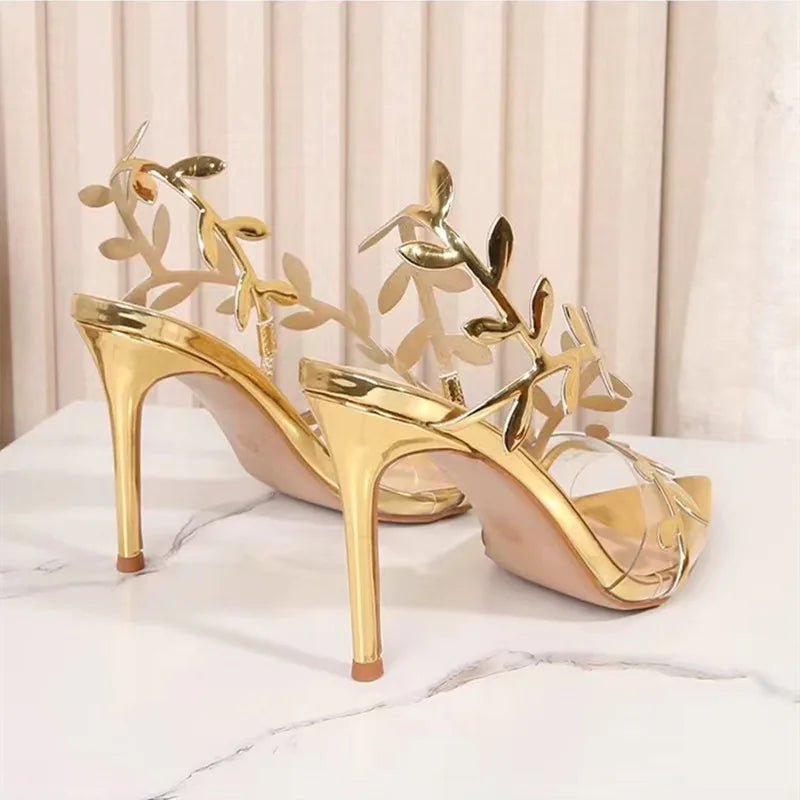 These shoes are so elegant.  the sole of the shoe is gold.  there is a gold branch with gold leaf's that wraps across the toes and up across the top of the foot and up and across the heel.  