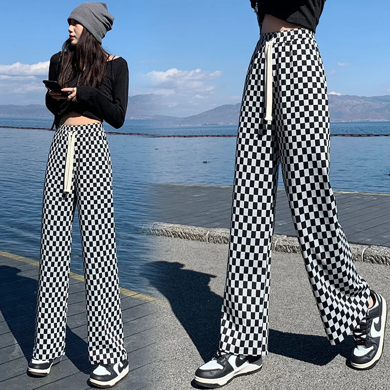 Elevate your casual wardrobe with our Woman's Black and White Checkered Lightweight Casual Pants. These pants offer comfort and style, perfect for any occasion. The black and white checkered design adds a touch of sophistication while the lightweight fabric keeps you cool and comfortable. Elevate your style today!