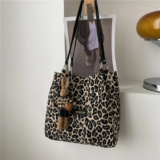 Take your style to the next level with our Leopard Print Shoulder Tote Bag! This stylish bag features a bold leopard print design that is sure to make a statement. With its spacious interior and convenient shoulder strap, it's perfect for carrying all your essentials while adding a touch of fierce to any outfit. Upgrade your wardrobe today!