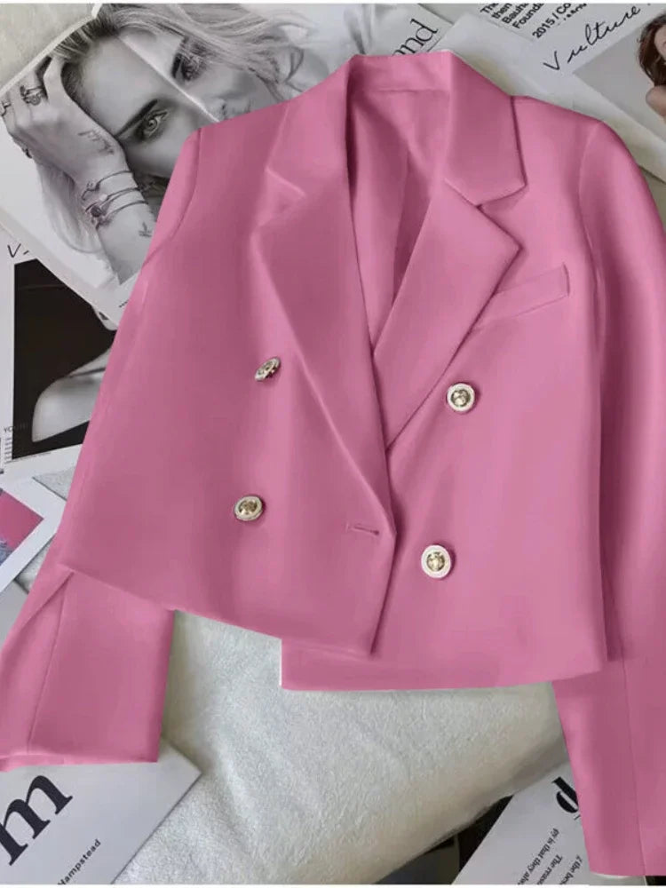 In pink.  With gold buttons - Introducing the ultimate in style and comfort - our Lightweight Double Breasted Large Lapel Crop Jacket from Thread Harbor Clothing Company. With its sleek design and 6 color options, this jacket is perfect for any occasion. Upgrade your wardrobe and stand out from the crowd!