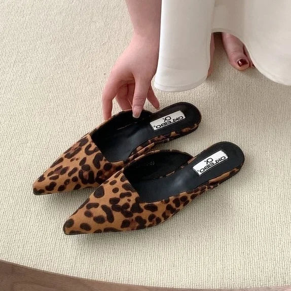 Elevate your style with our Pointed Toe Leopard Print Loafers! Slip on these chic mules and step out in confidence with their low heel and comfortable slip-on design. With a trendy leopard print design, these loafers will add a bold touch to any outfit. Perfect for casual wear, you'll love the effortless and stylish look these shoes bring.