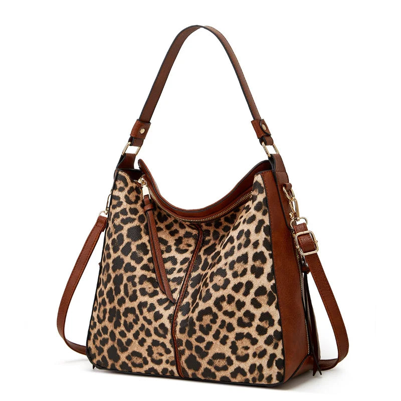 Leopard Print bag with matching shoulder strap.  Stay stylish and organized with our Large Capacity Leopard/Cow Print Shoulder Bag. Includes a matching wallet for added convenience. Perfect for on-the-go fashionistas!