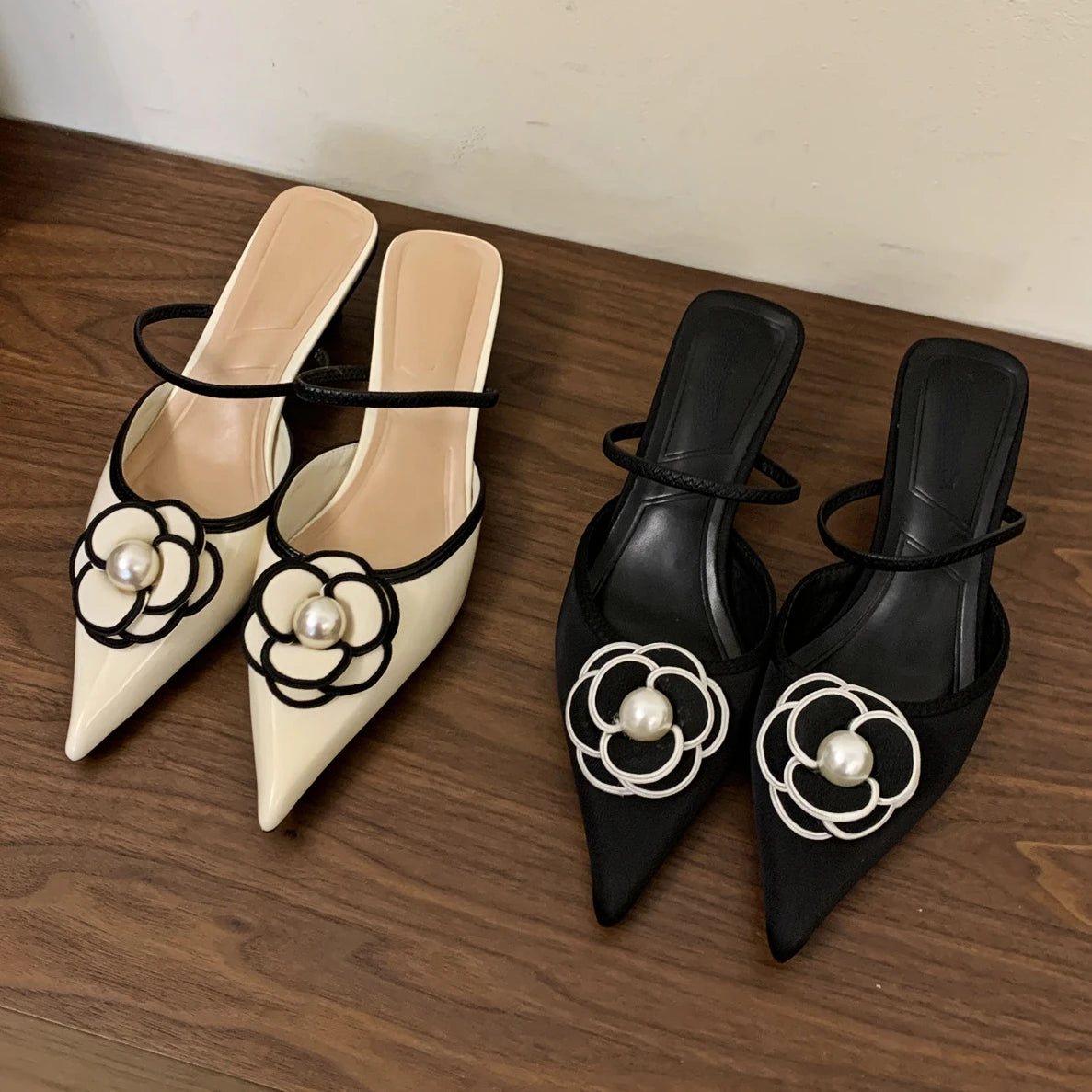 Step out in style and comfort with our Pointed Toe High Heels! Our luxury designer sandals feature an elegant pointed toe and fashion-forward design that will elevate any outfit. The flower embellishments add a touch of charm and femininity. Perfect for any occasion, these pumps will make you feel confident and sophisticated.