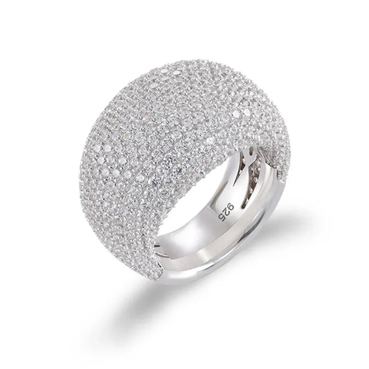 Add a touch of glitz and glam to any outfit with our Sterling Silver Pave Setting Statement Ring! Adorned with sparkling cubic zirconium crystals, this ring is sure to catch the eye and add a touch of elegance to your look. Made with high-quality sterling silver, it's the perfect statement piece for any occasion.