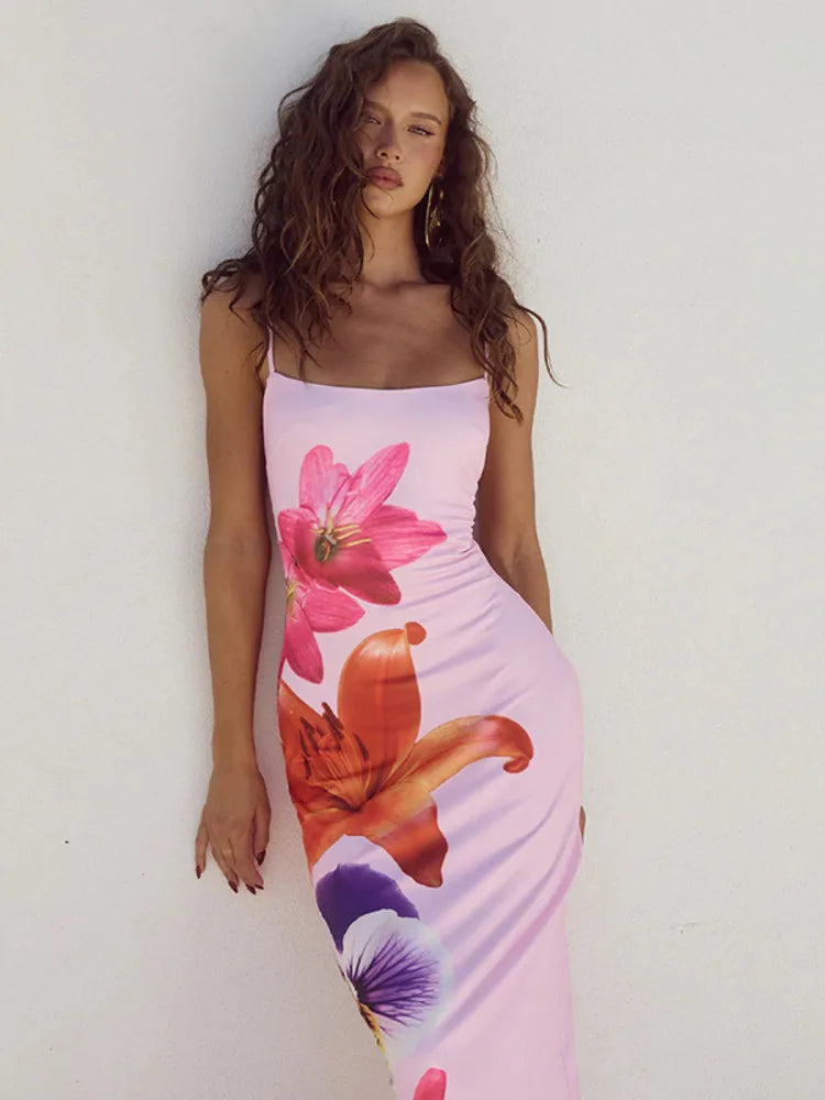 This Summer Spaghetti Strap Floral Print Backless Bodycon Maxi Dress is a must-have for any fashion-forward woman! With its vibrant floral print and flattering bodycon silhouette, this dress is perfect for any summer occasion. The backless design adds a touch of allure, making you feel confident and beautiful. Don't miss out on this stunning dress!