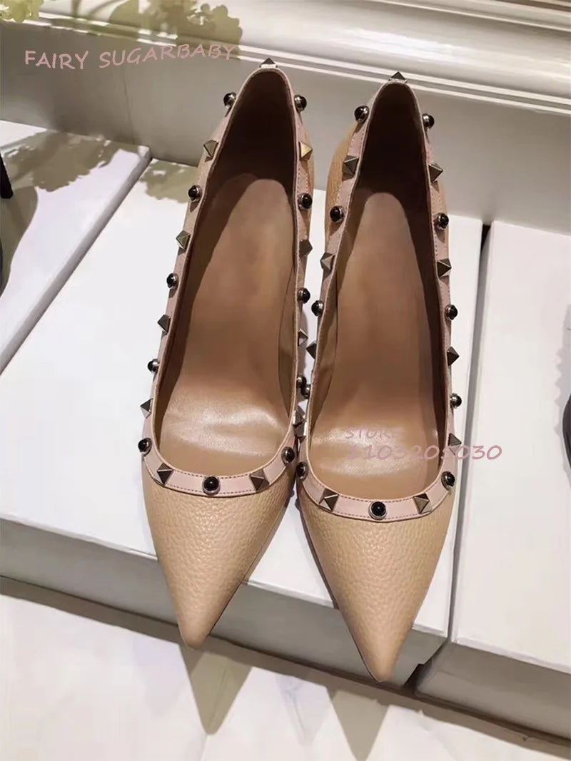 Featuring a sleek faux leather construction, these pumps exude timeless elegance with a modern twist. The spike embellishments add a hint of edginess, while the classic silhouette ensures versatility and sophistication.